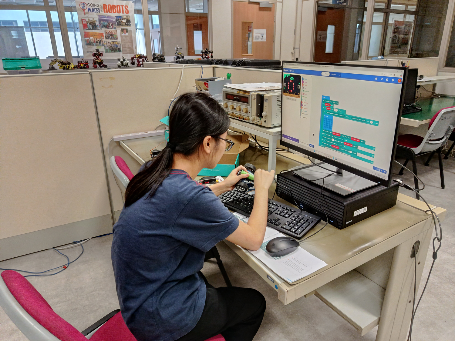 A person programming a robot.
